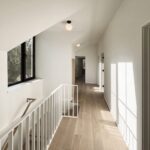 Home A upper hallway at Haus L1 — multigenerational multiplex renovation in The Beaches, Toronto by baukultur/ca.
