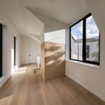 Home A landing at Haus L1 — multigenerational multiplex renovation in The Beaches, Toronto by baukultur/ca.