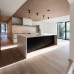 Home A kitchen island at Haus L1 — multigenerational multiplex renovation in The Beaches, Toronto by baukultur/ca.