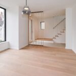 Home A living area and stair at Haus L1 — multigenerational multiplex renovation in The Beaches, Toronto by baukultur/ca.
