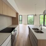 Home B kitchen at Haus L1 — multigenerational multiplex renovation in The Beaches, Toronto by baukultur/ca.